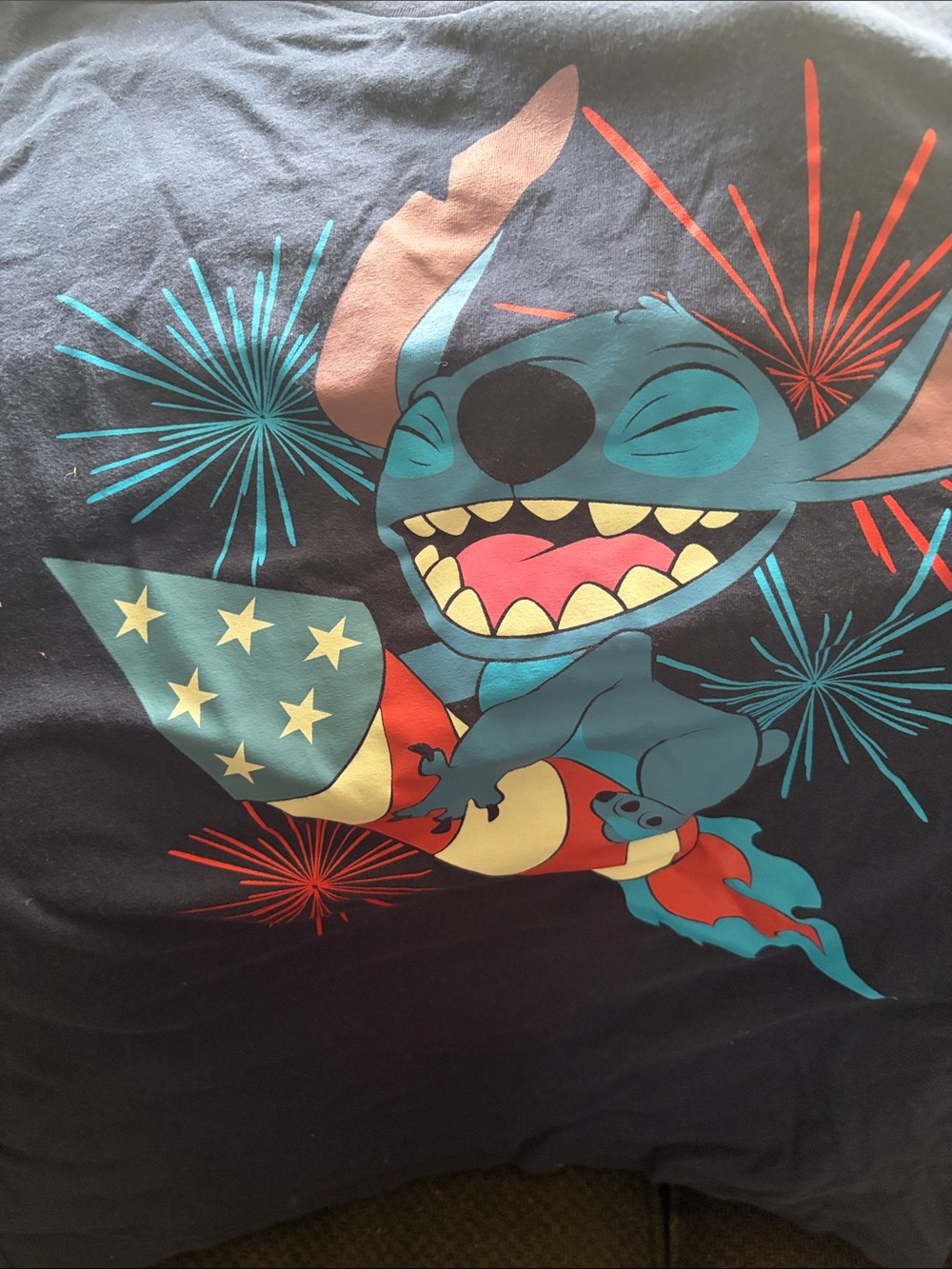 Disney Black Tee with Blue Stitch and Red Fireworks Graphic